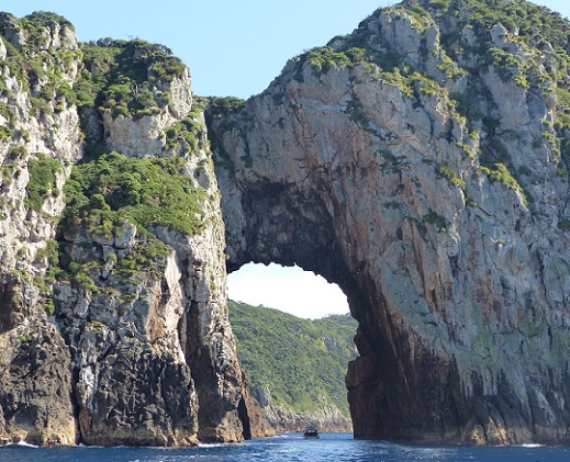 Archway Island with a boat passing through the arch